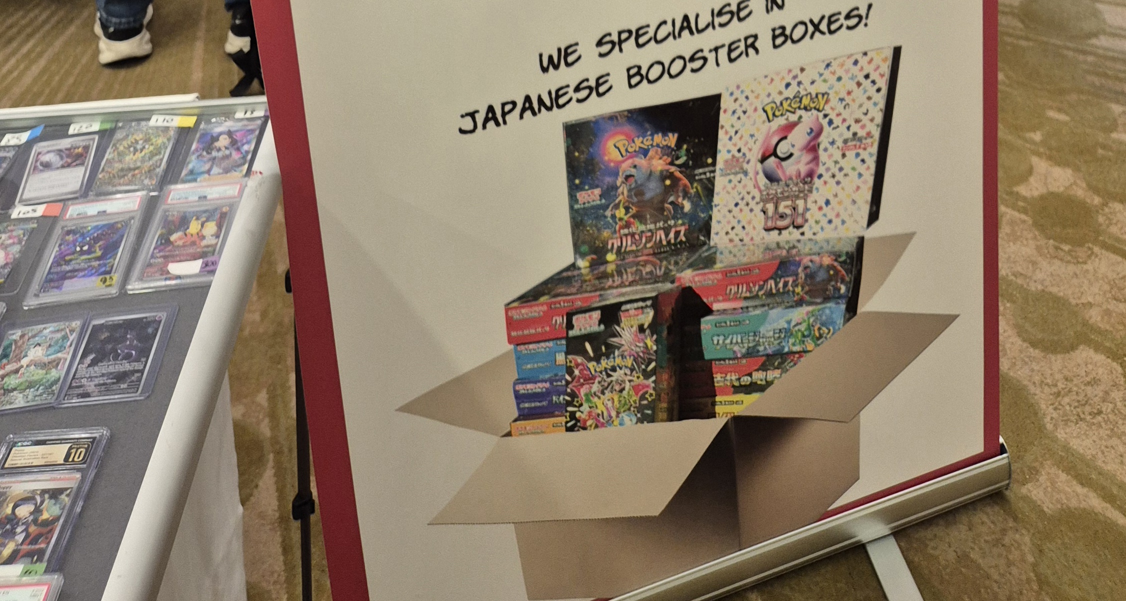 Convention signage and Pokémon cards