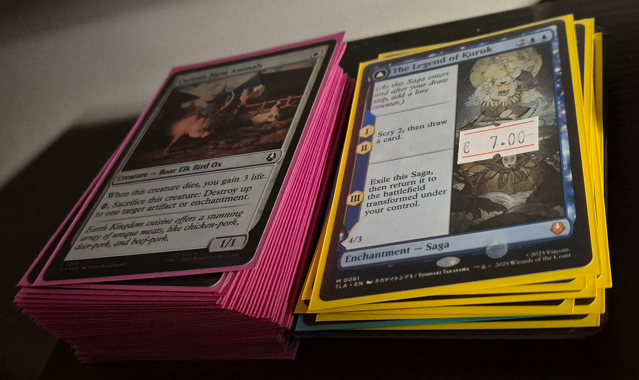 Two stacks of sleeved cards
